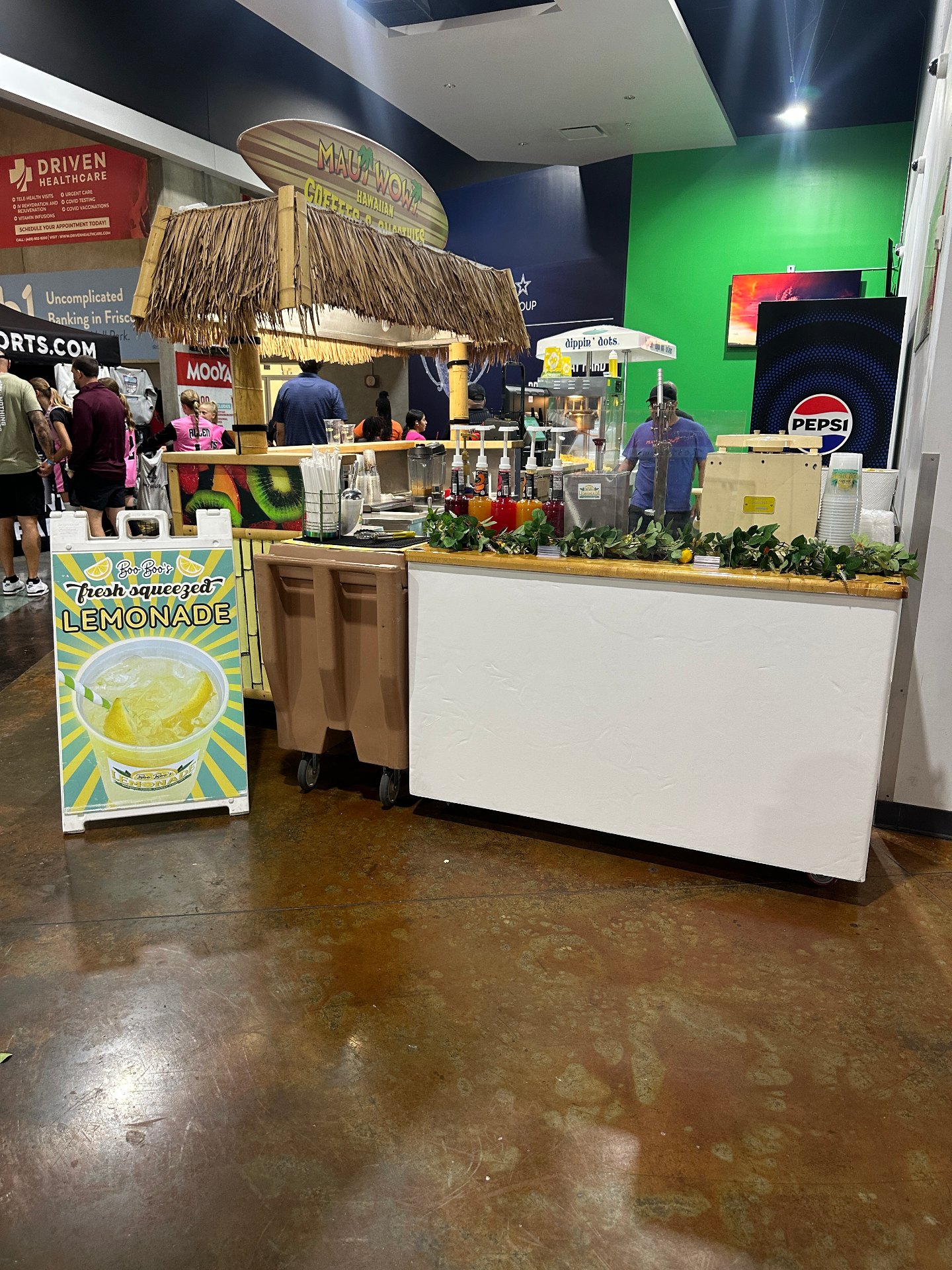 Lemonade service setup at a large indoor arena