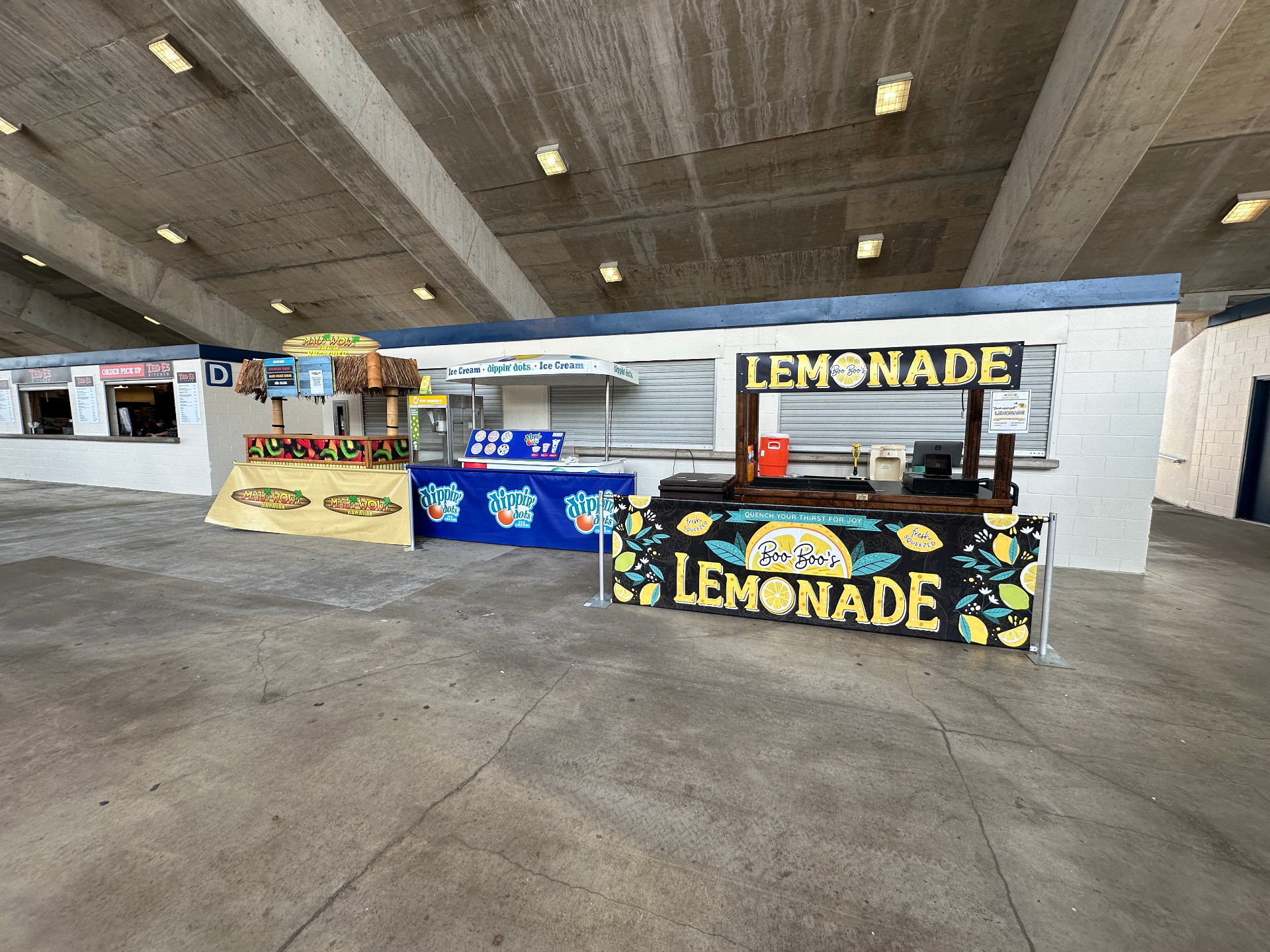Wide view of lemonade stand at stadium concourse