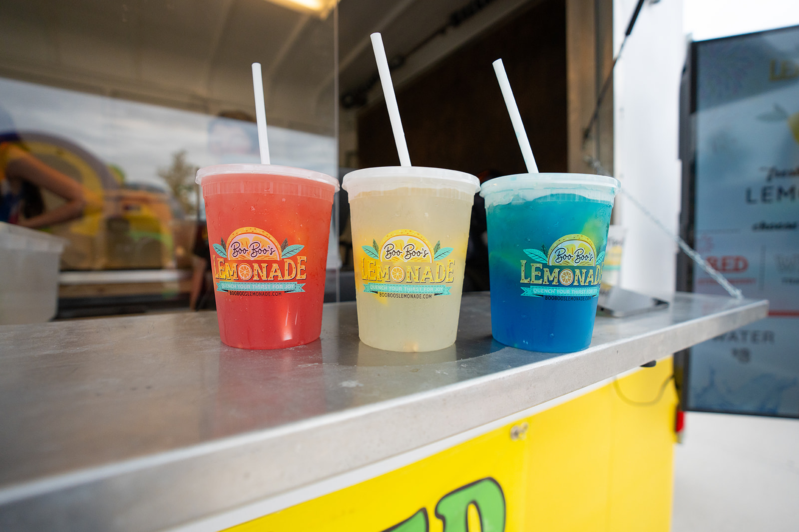 Three colorful lemonades on the counter