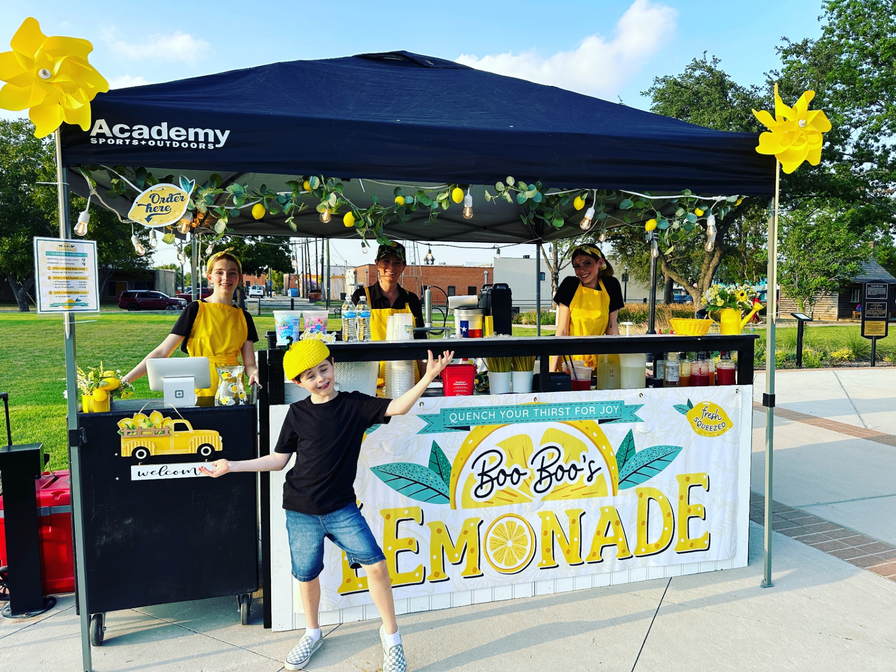 The Boo Boo's family and kids at the booth