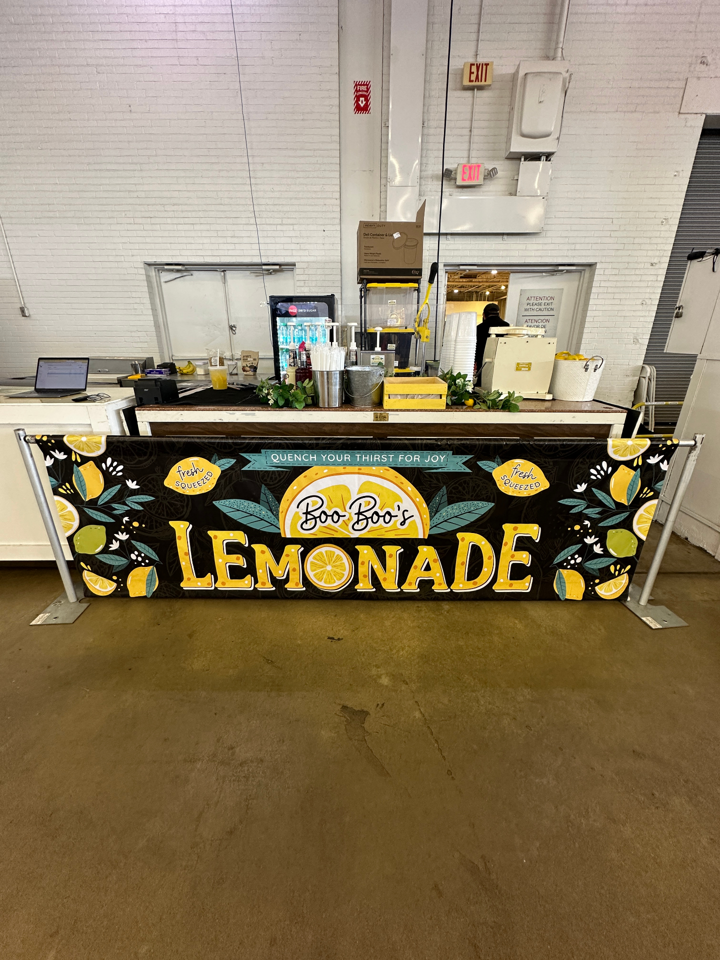 Indoor lemonade bar with Boo Boo's banner