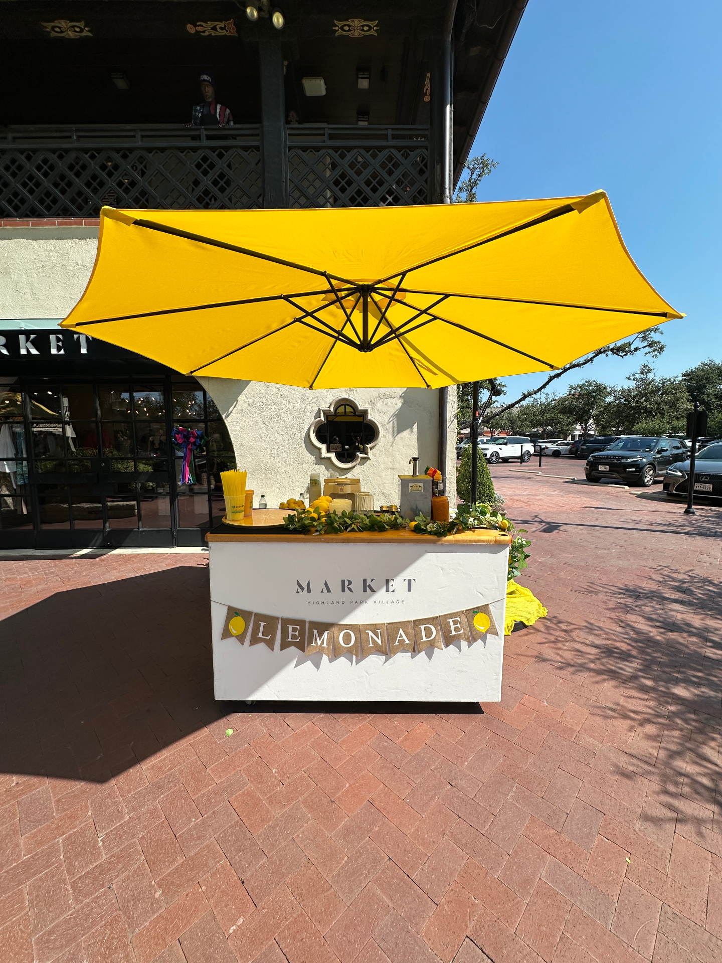 Front view of market umbrella lemonade station