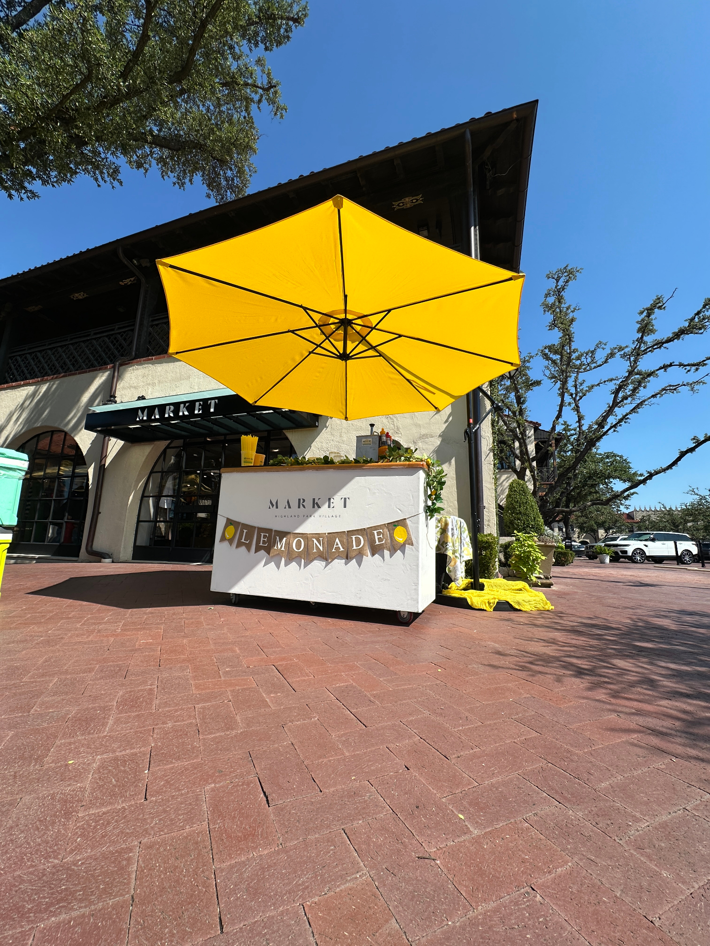 Wide low-angle shot of market umbrella stand