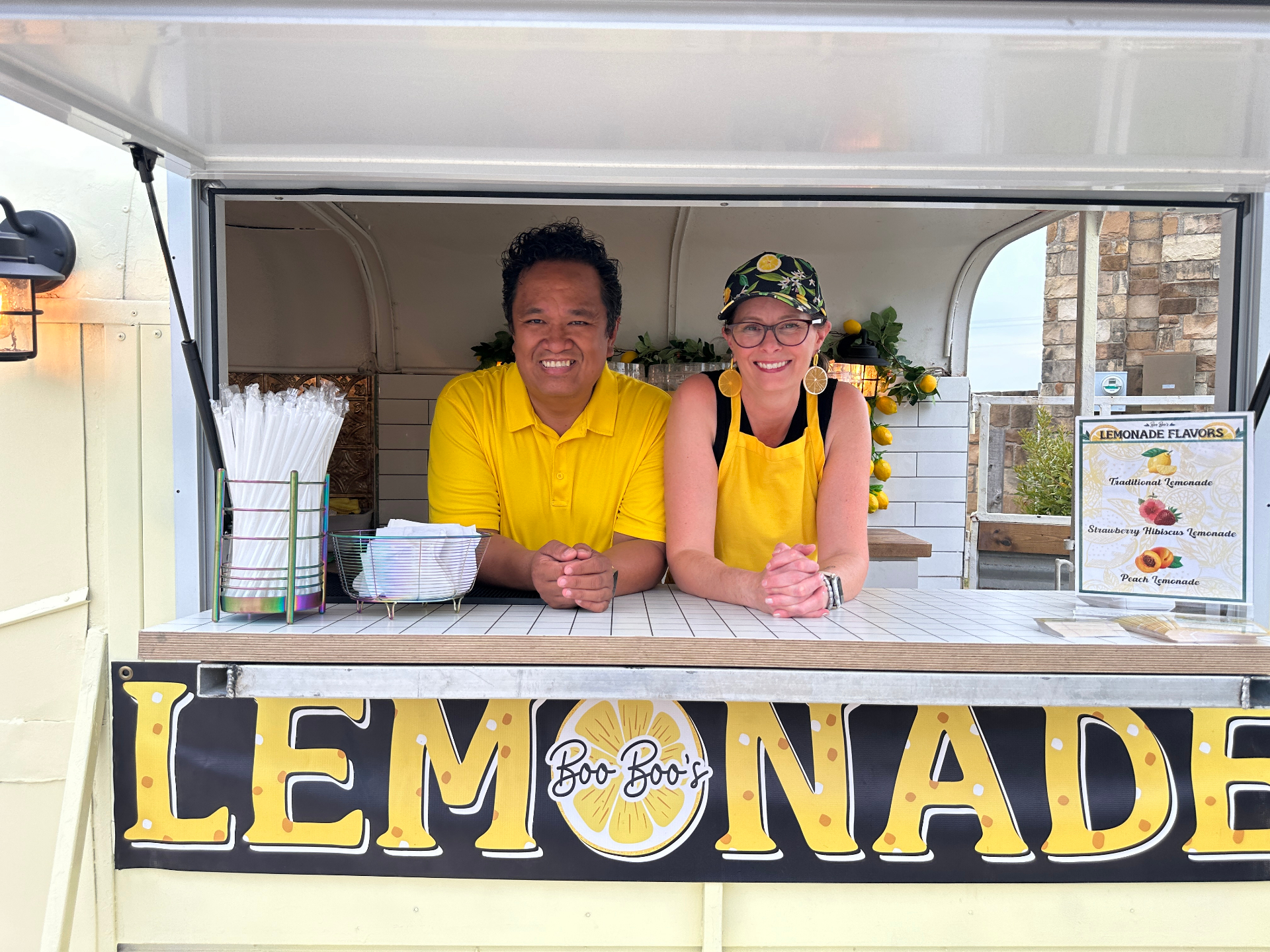 Don and Amy smiling at the lemonade window