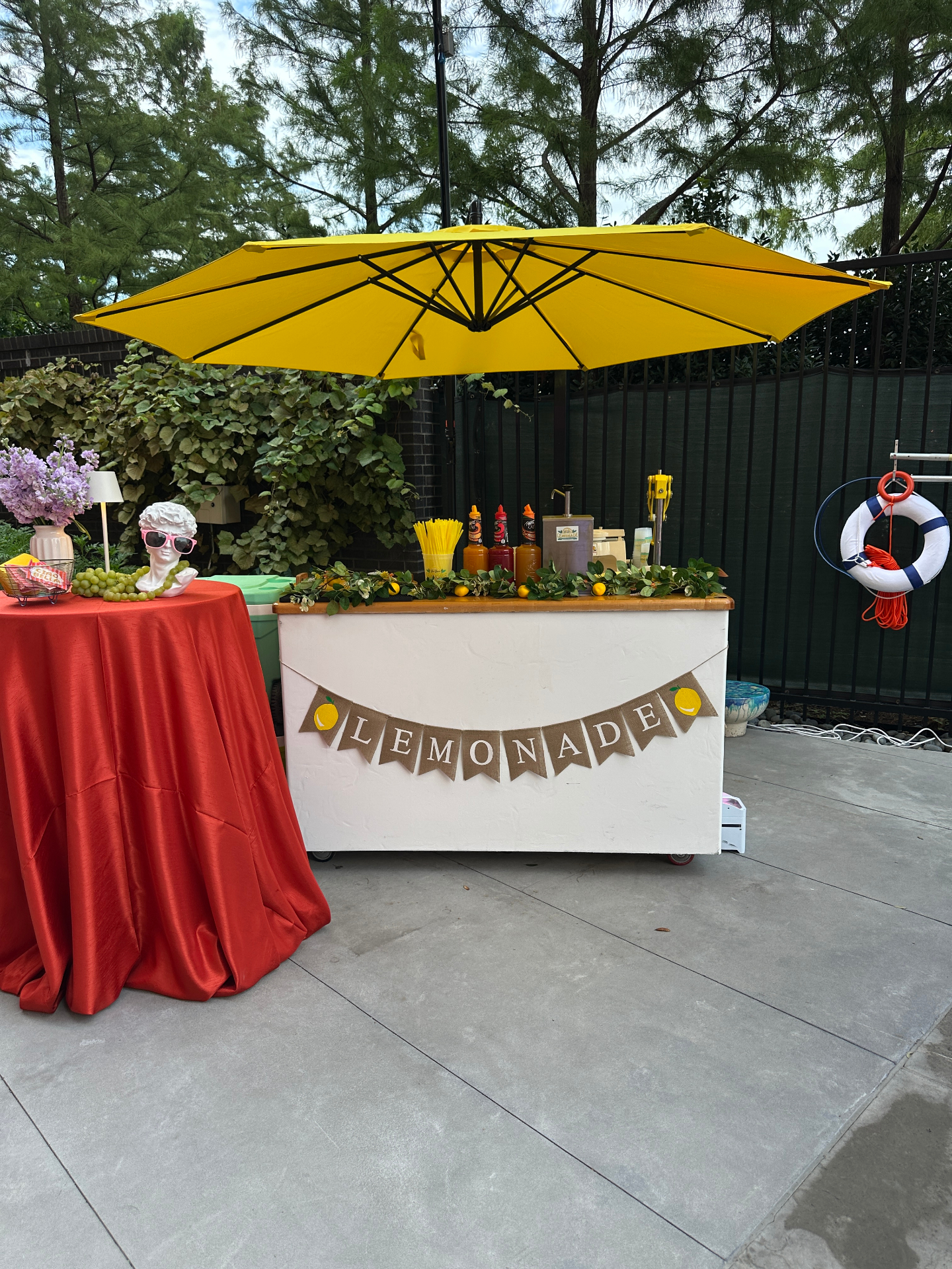 Poolside lemonade bar with yellow umbrella