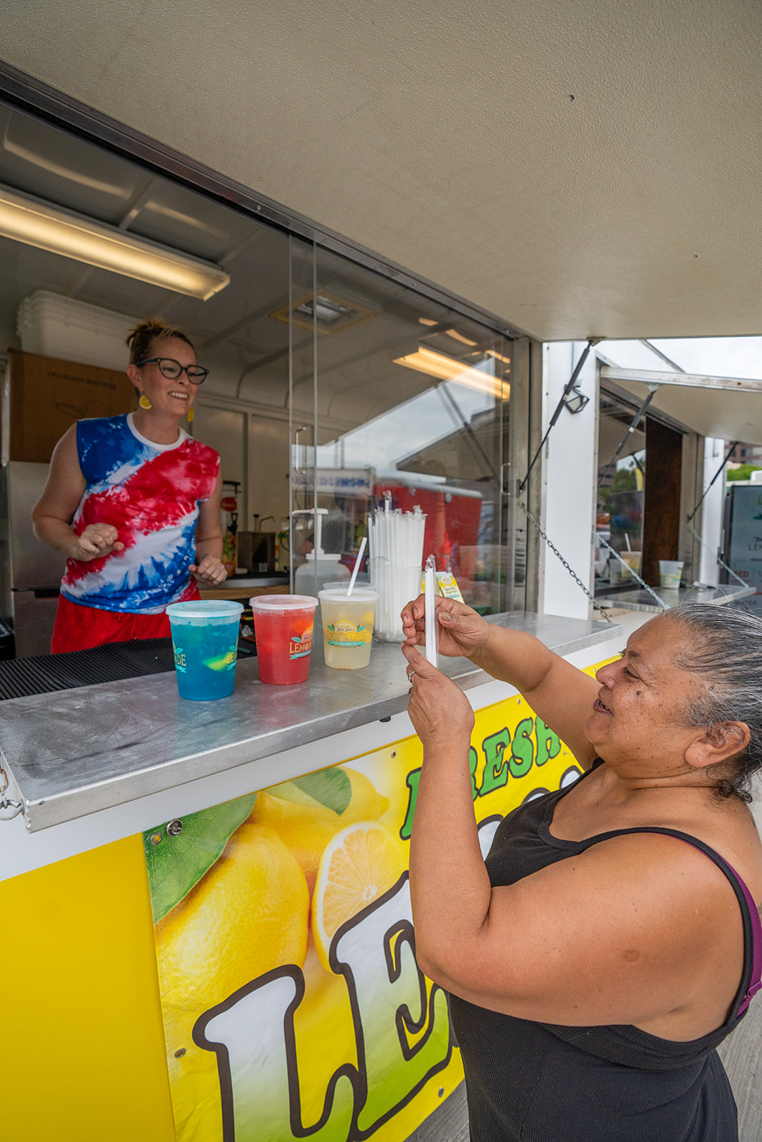 Serving a happy customer at the window