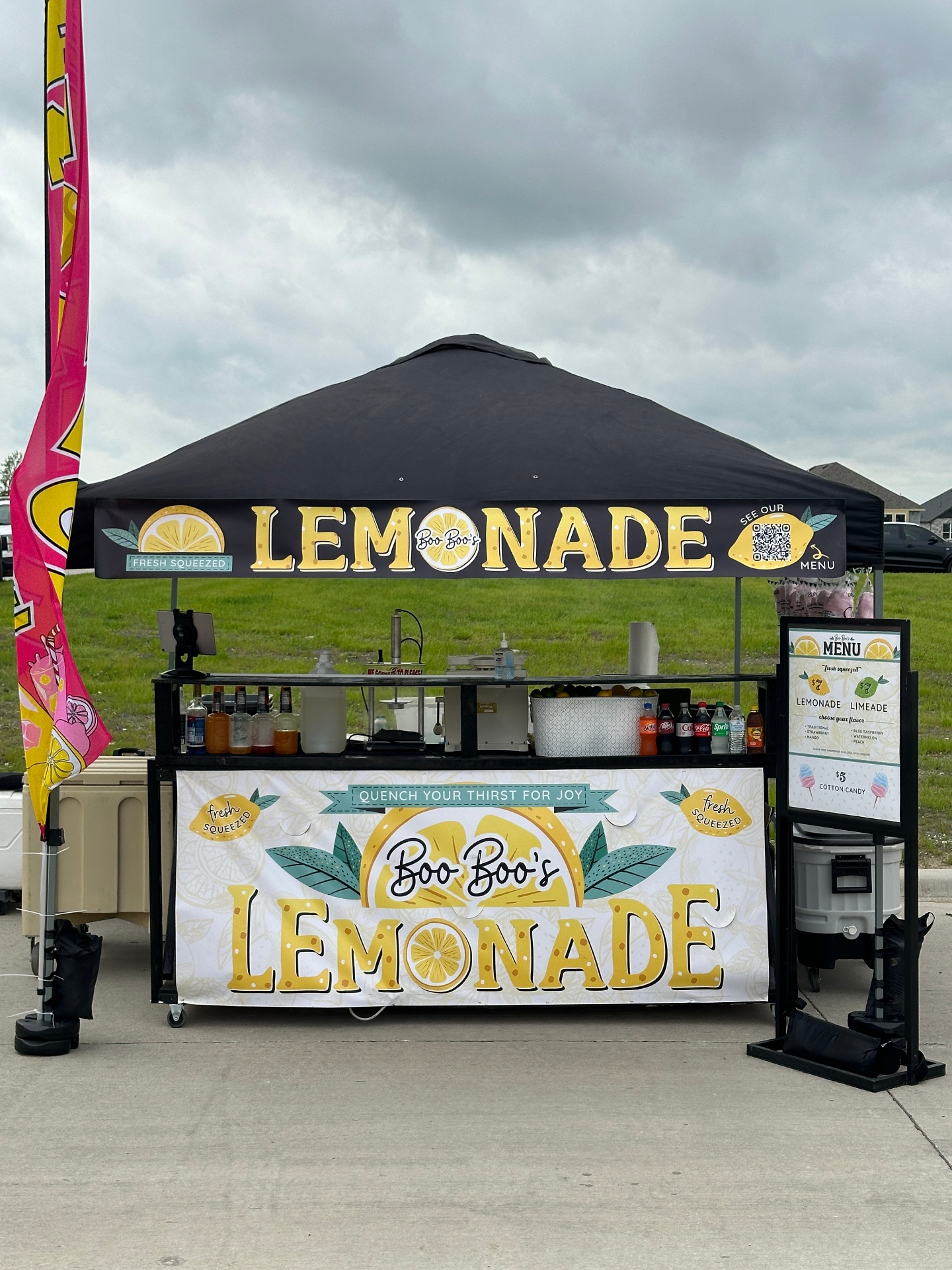 Lemonade canopy setup under cloudy skies