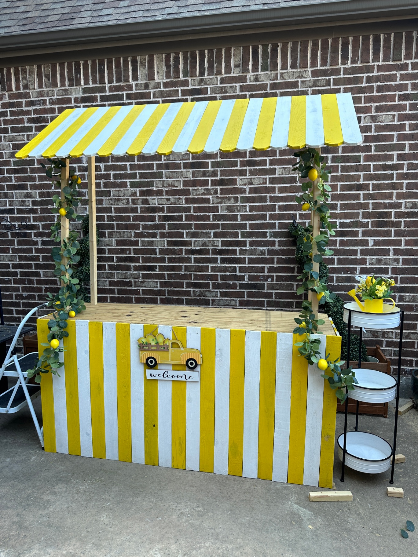 Yellow and white striped lemonade stand setup
