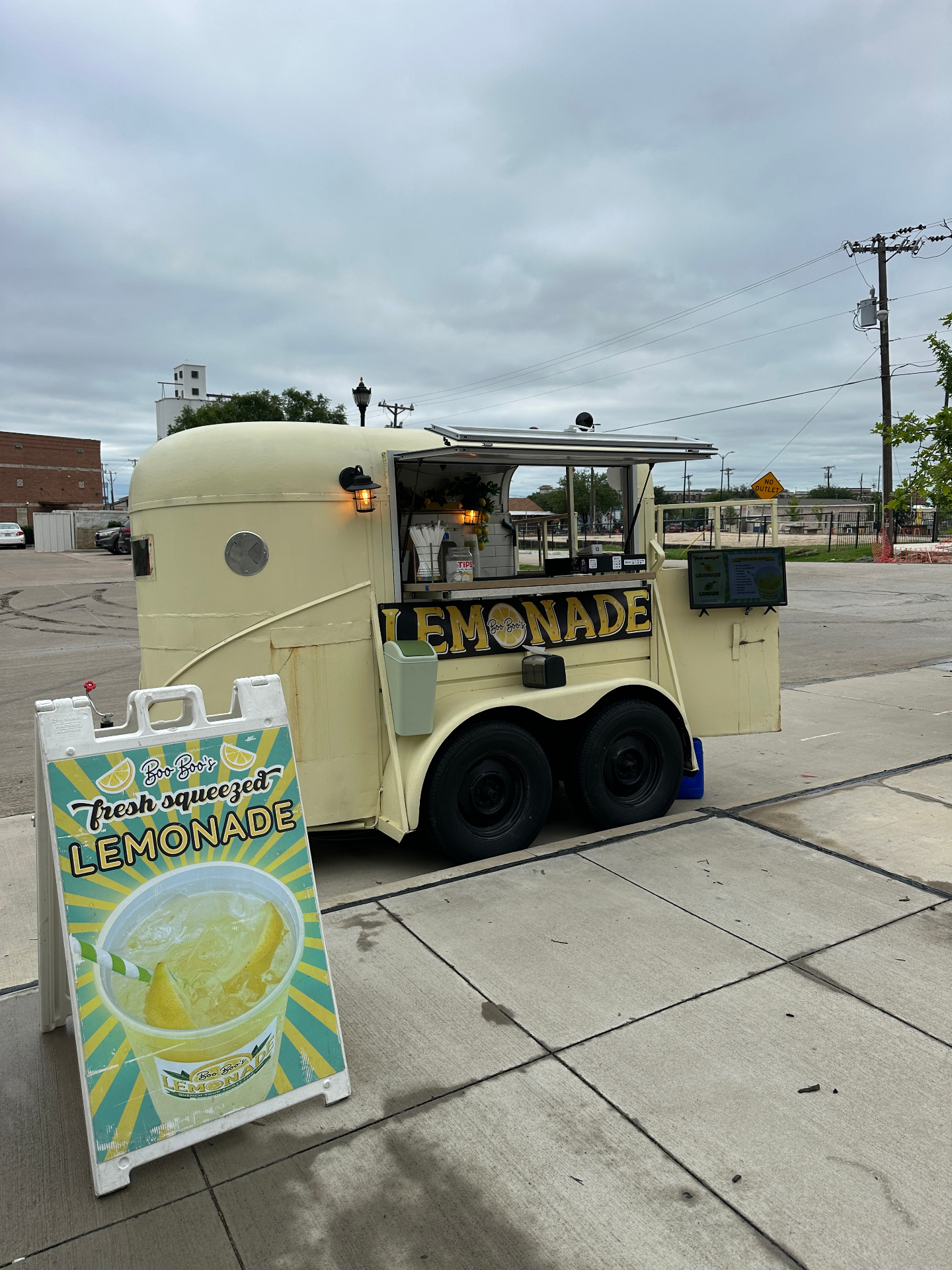 Trailer with A-frame sign on the street