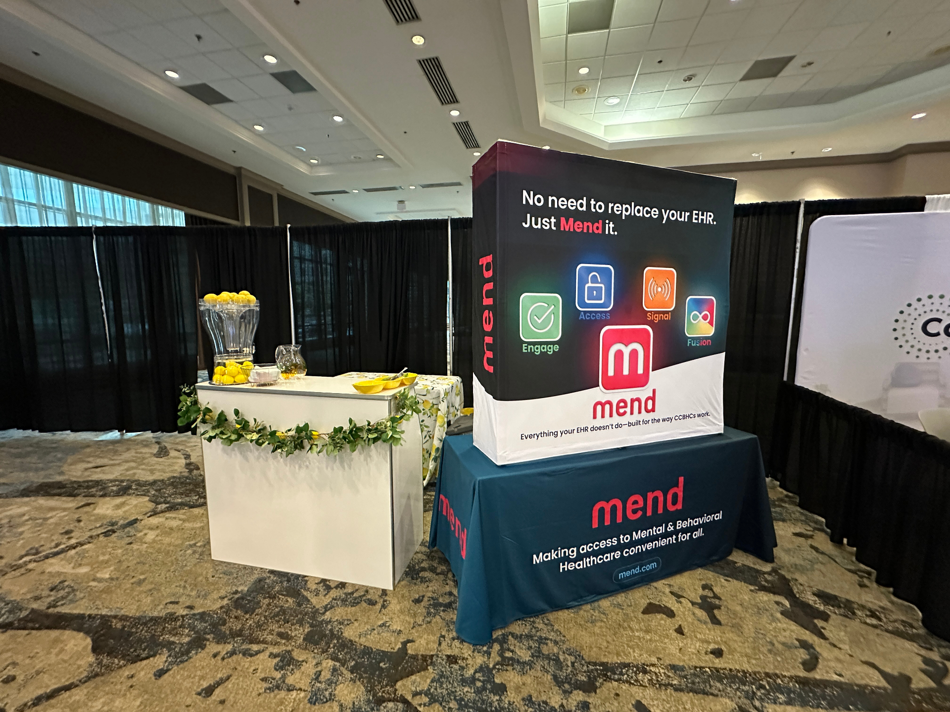 Lemonade station beside a corporate expo booth