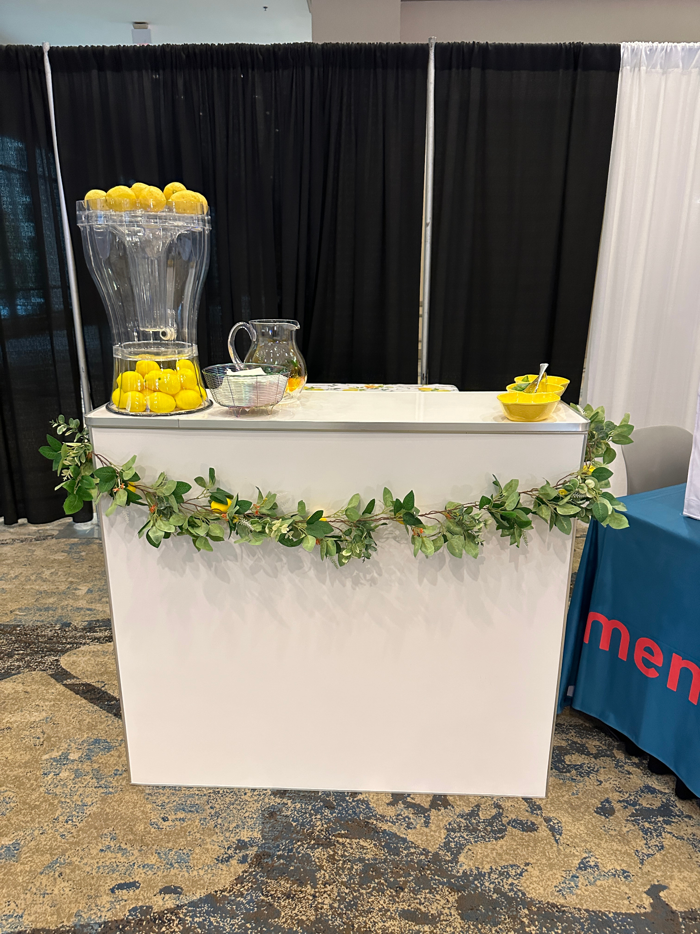 Modern white lemonade bar setup with fresh lemons